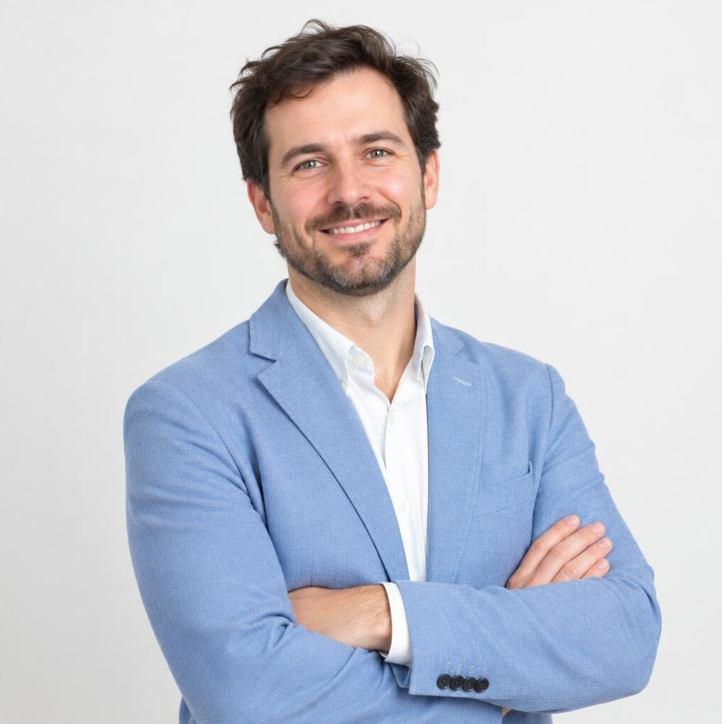 Smiling man in a business casual jacket in a studio